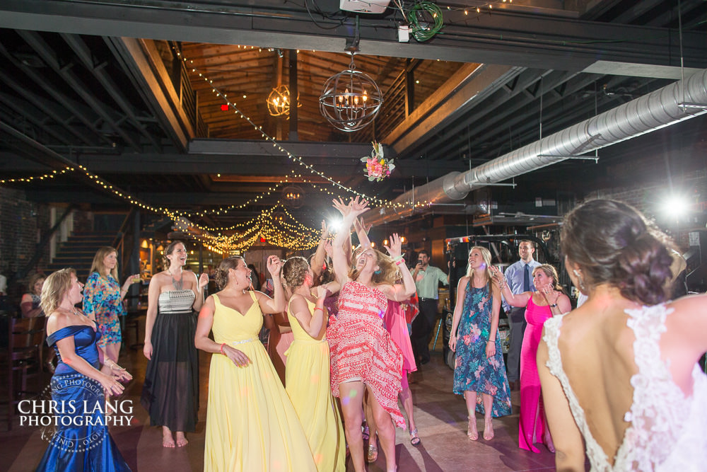 bouguet toss  - bride - ironclad brewery - wedding photo - wedding photography - wedding & reception ideas - 