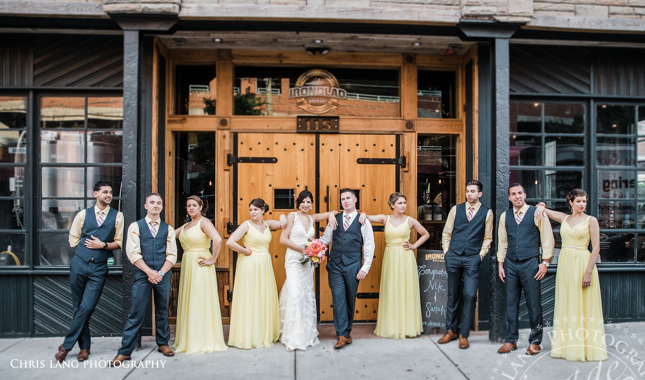 Ironclad Brewery Weddings - bridal party in fron of Ironclad Brewery - weddinfg and reception venue - Wilmington NC - Wedding Photography - Ideas - Inspiration