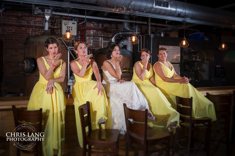 bridesmaids sitting on top of bar - ironclad brewery - wedding photo - wedding photography - wedding & reception ideas - 