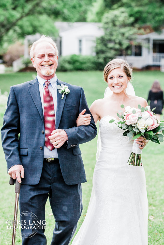 father walking daughter down the isle  - 