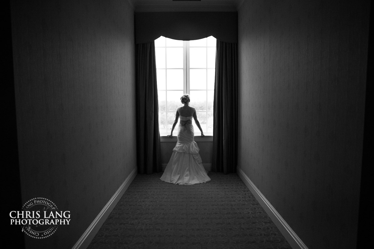 bride in wedding dress befoer ceremony at river landing wedding venue - pre wedding photos - wedding photo ideas - getting ready wedding pictures - bride - groom - wedding dress - wilmington nc wedding photography  