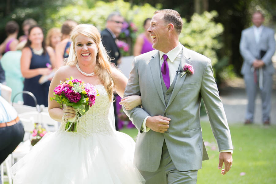 Bride and groom walking down the isle - Garden Wedding -natural light wedding photo - wedding photography ideas - Wilmington NC Wedding Photography - Airle Gardens