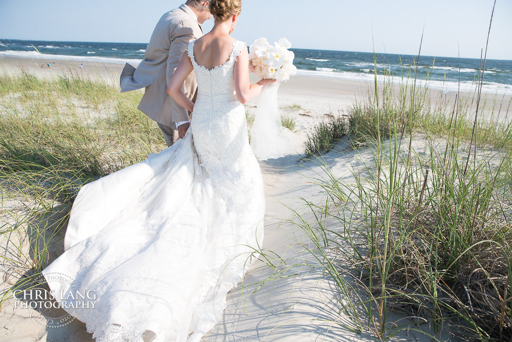 beach wedding - destination wedding - Bald Head Island - bride and groom walking down beach trail - wilmington wedding photography - wedding photo ideas - natural light wedding photography 