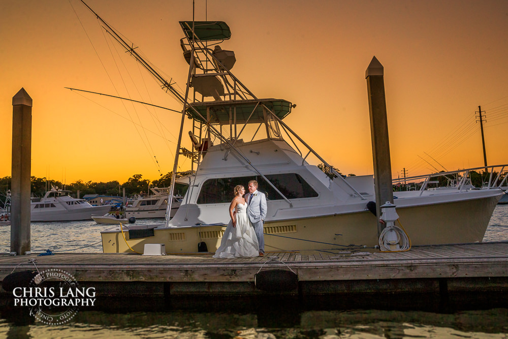 Wrightsville Beach Weddings - beach weddings - sunset wedding photo - the golden hour - bride & groom - wedding dress - sunset wedding photography - twlight on the beach