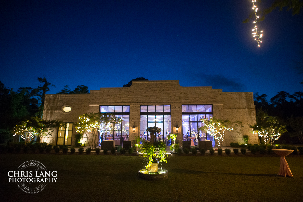 Wrightsville Manor wedding venue - Wilmington NC - image of the fron of Wrightsville Manor at sunset withthe lights on.