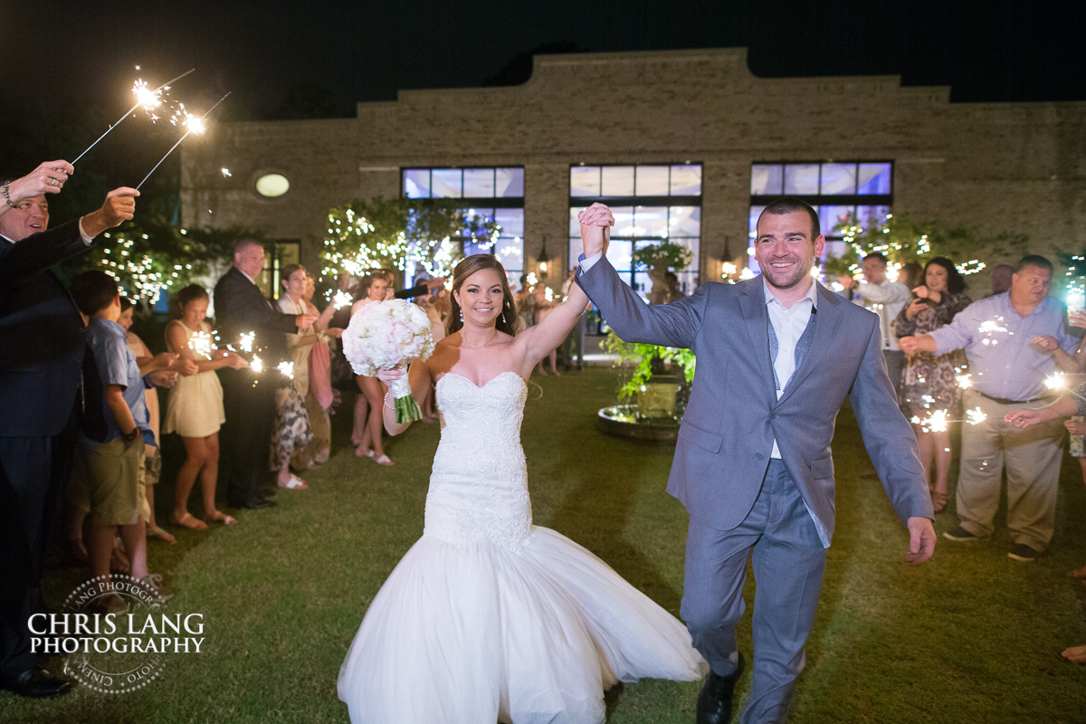image of bride and groom sparkelr exit at Wrightsville Manor - Wilmington NC Wedding venues