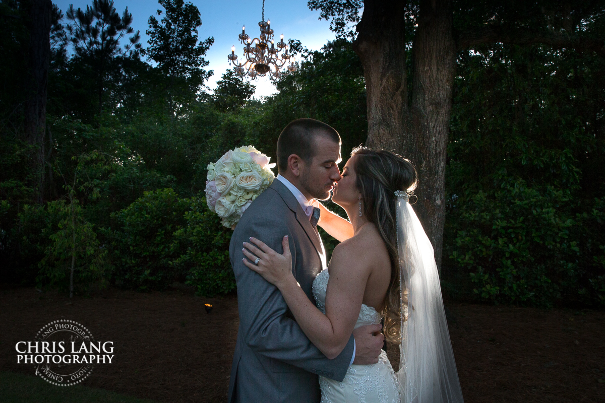 Bride and groom picture under the oak tree at wrightsville manor in wilmington nc - wedding venues - wedding  photography 